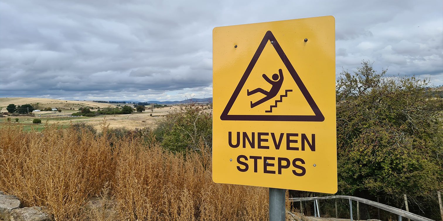 Caution sign that says ‘Uneven Steps’