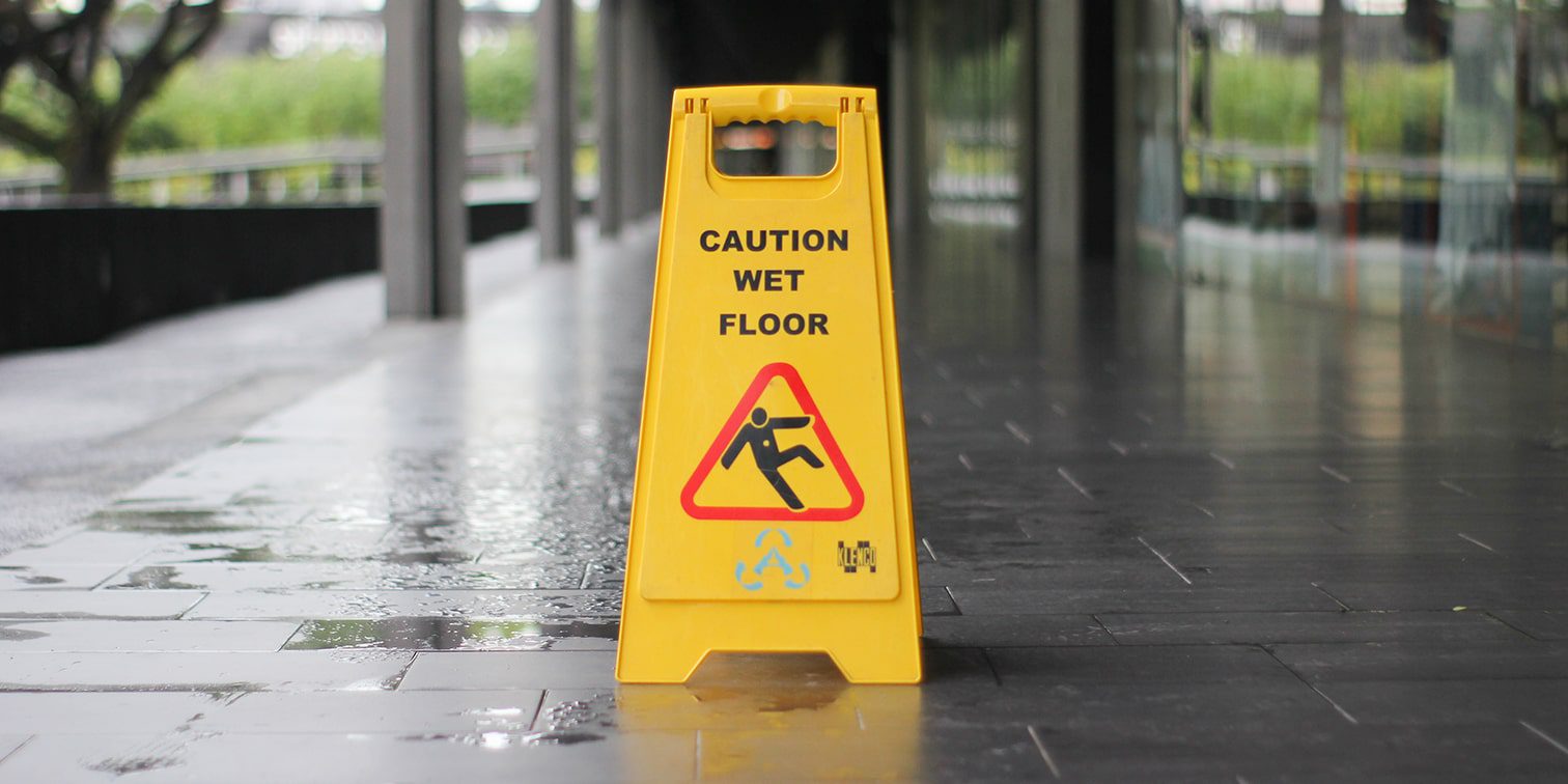 Caution wet floor sign to prevent a slip and fall
