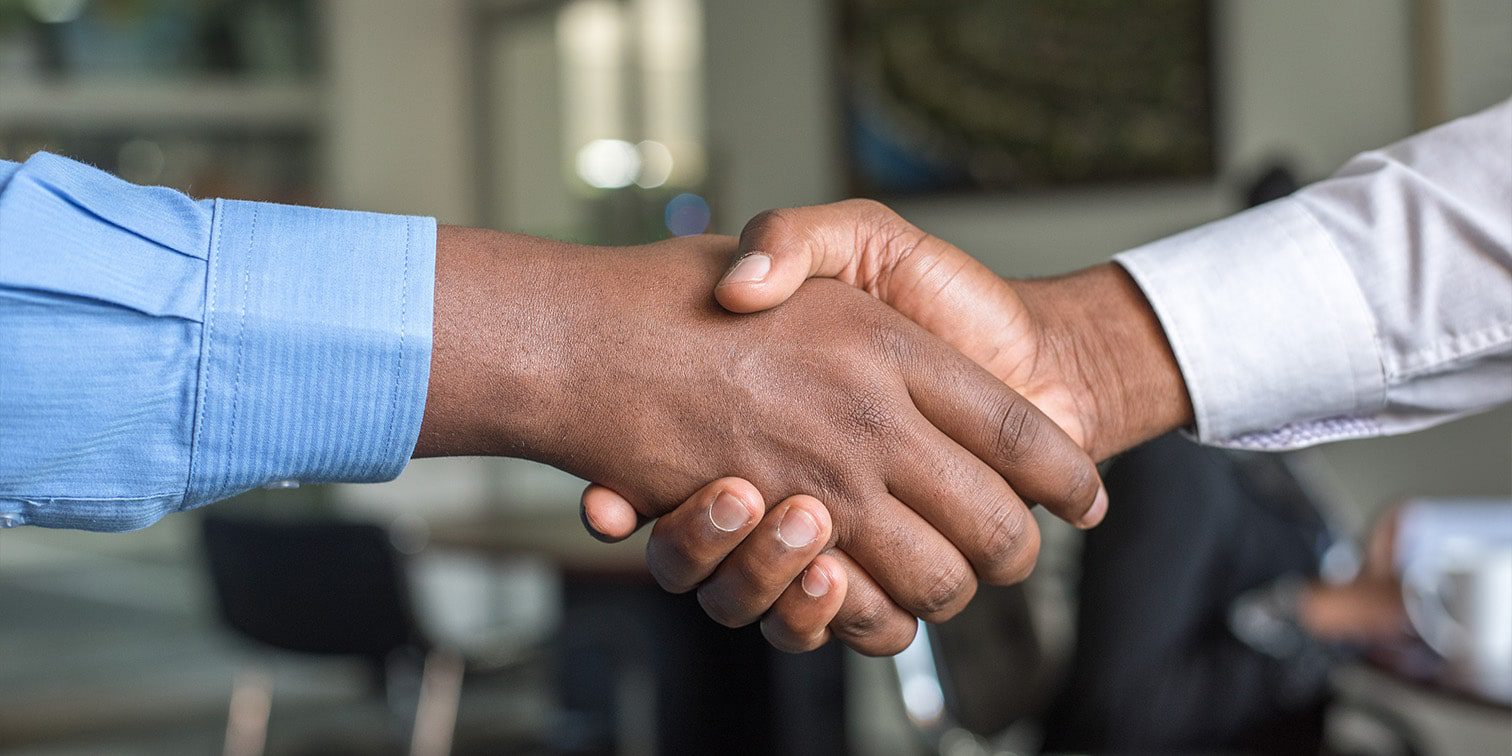 Two people shaking hands