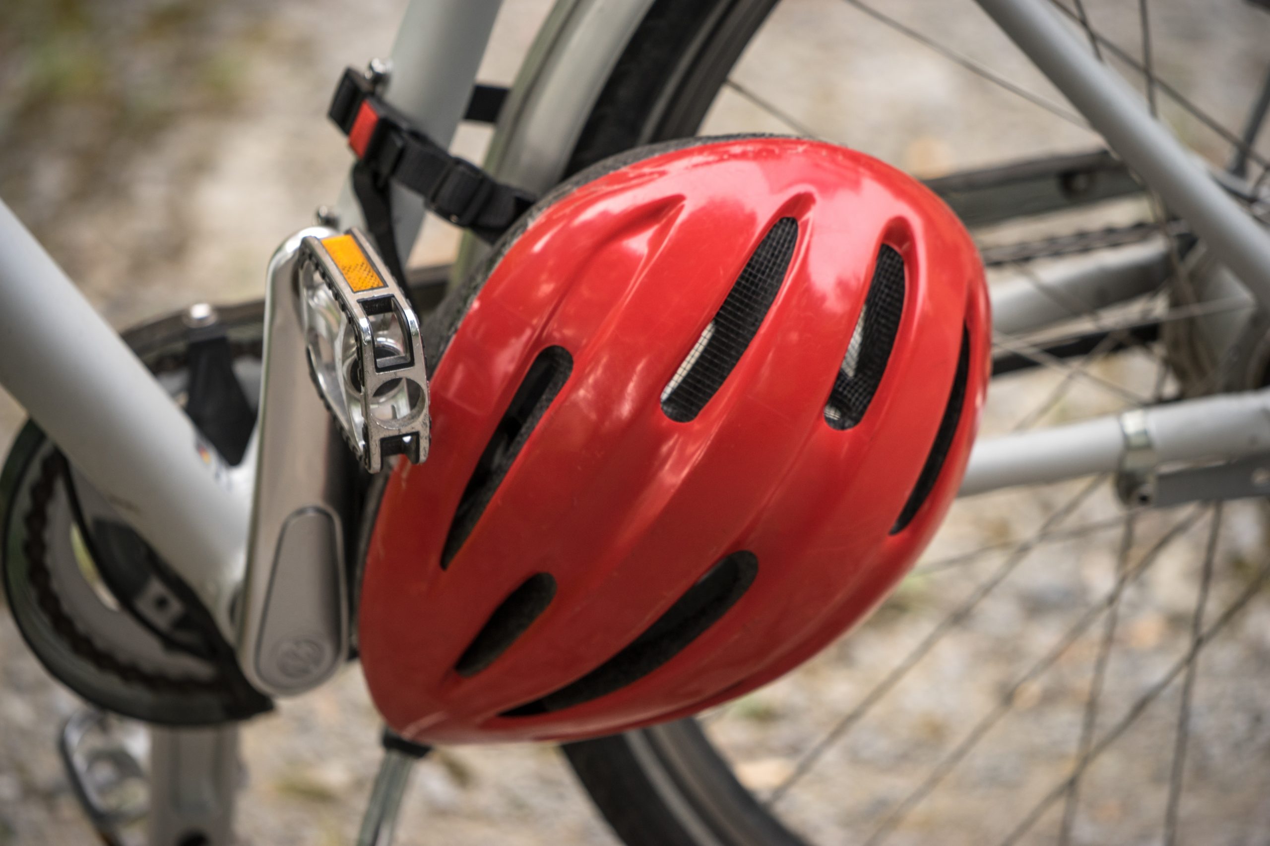 A close up of a red bicycle helmet