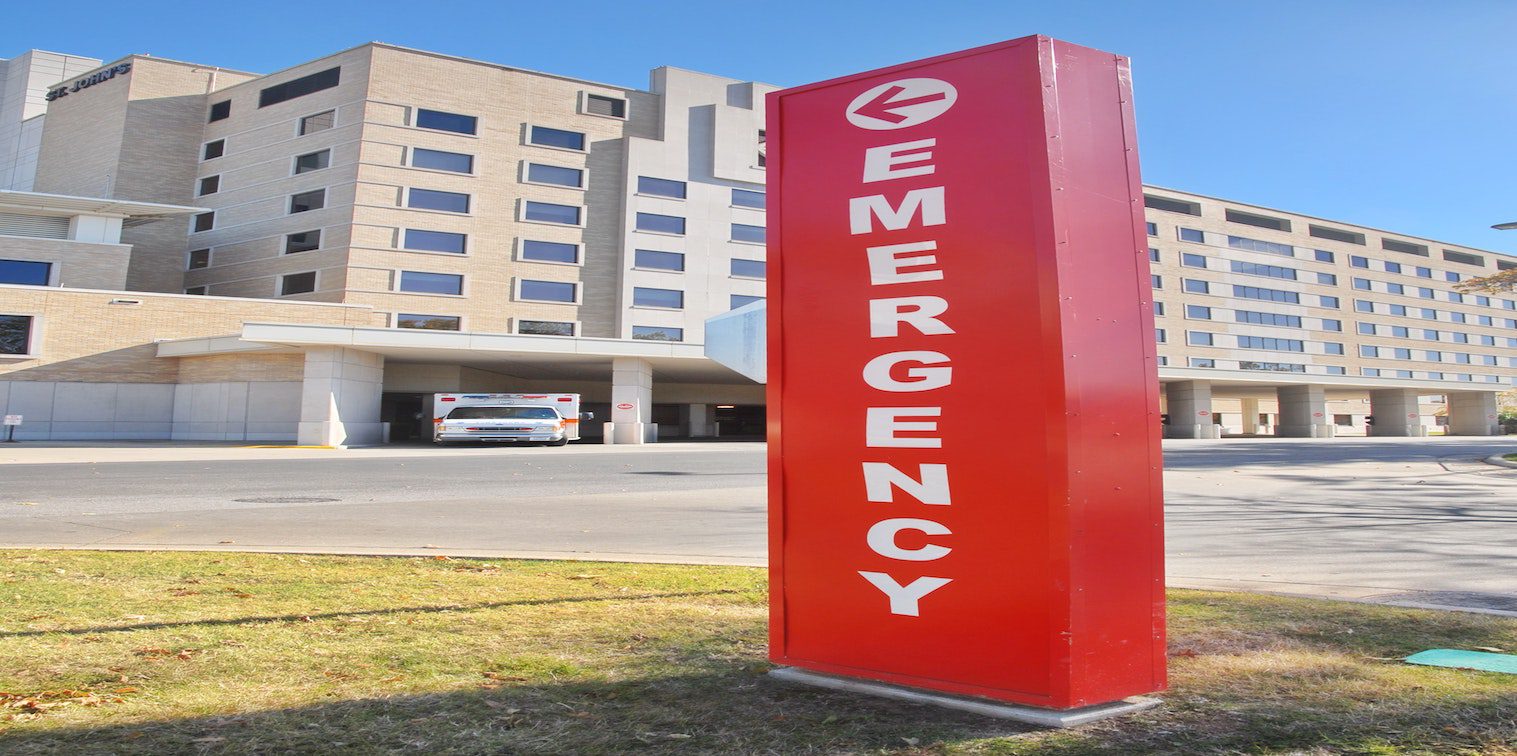 Red emergency sign in front of a hospital