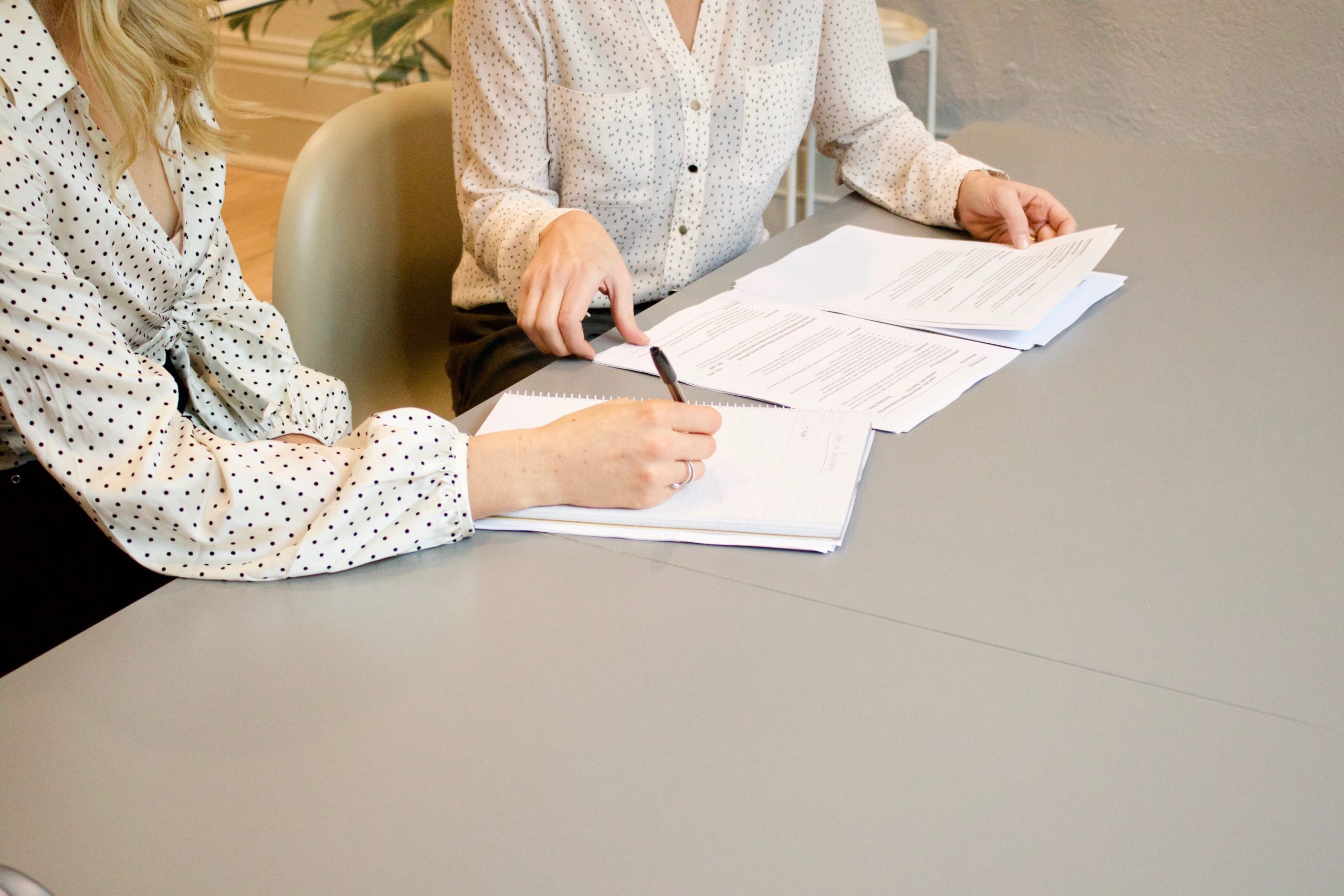 An Attorney and a Client signing files