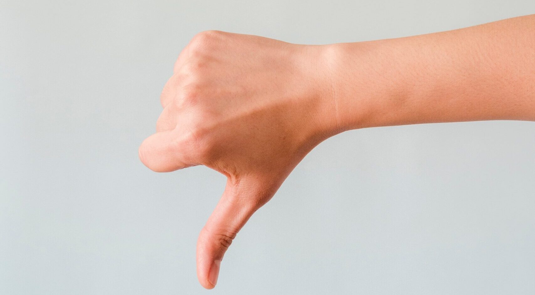 Image of a finger showing thumbs down