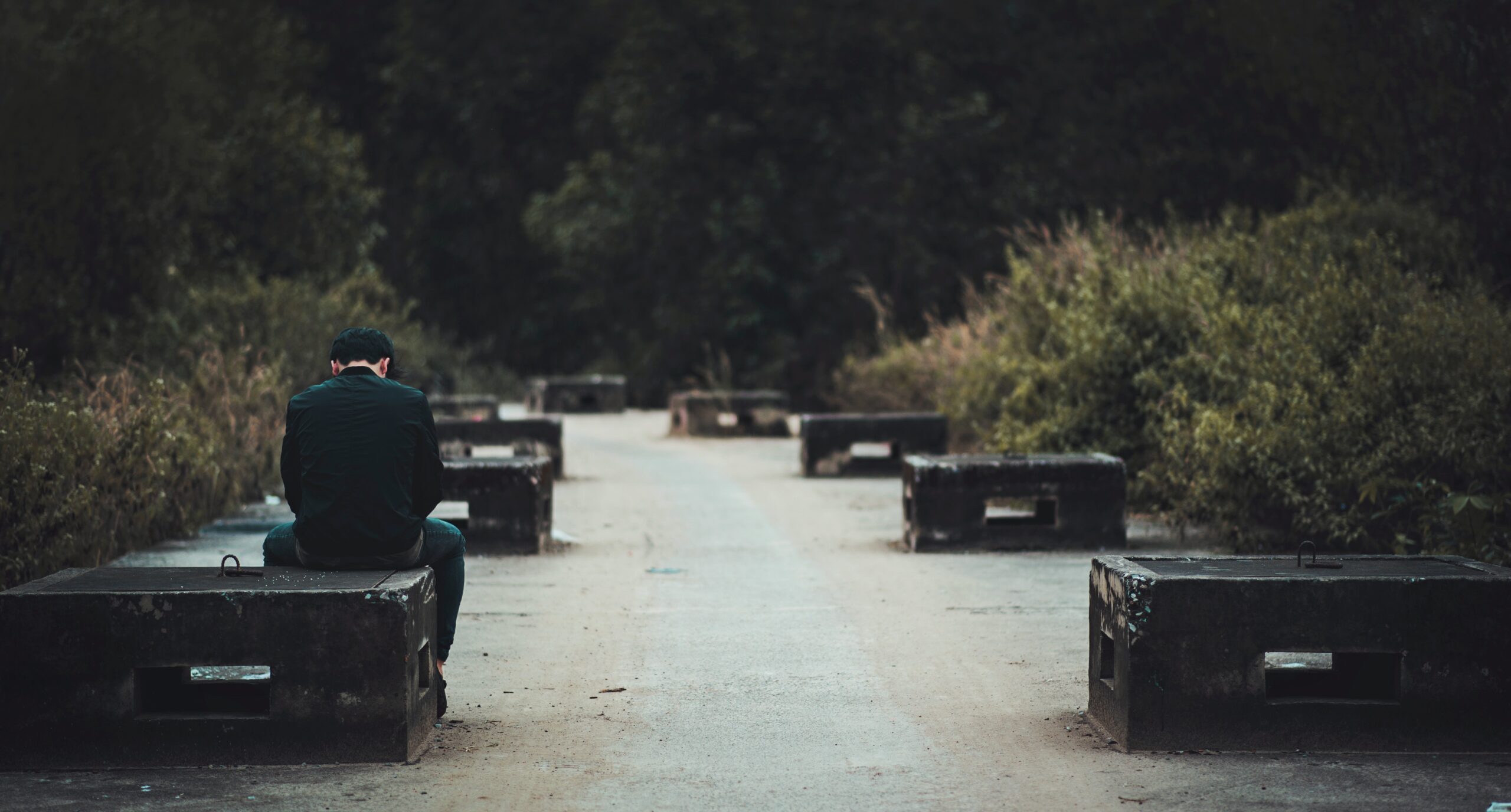 A man sitting alone, thinking