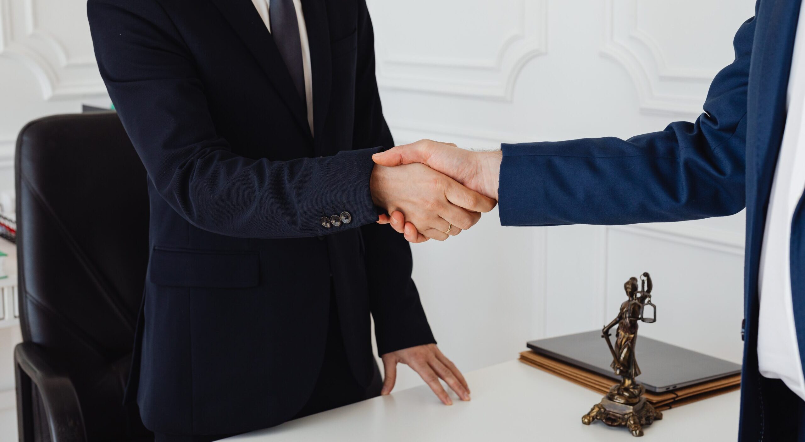 Exchanging handshake with with lawyer