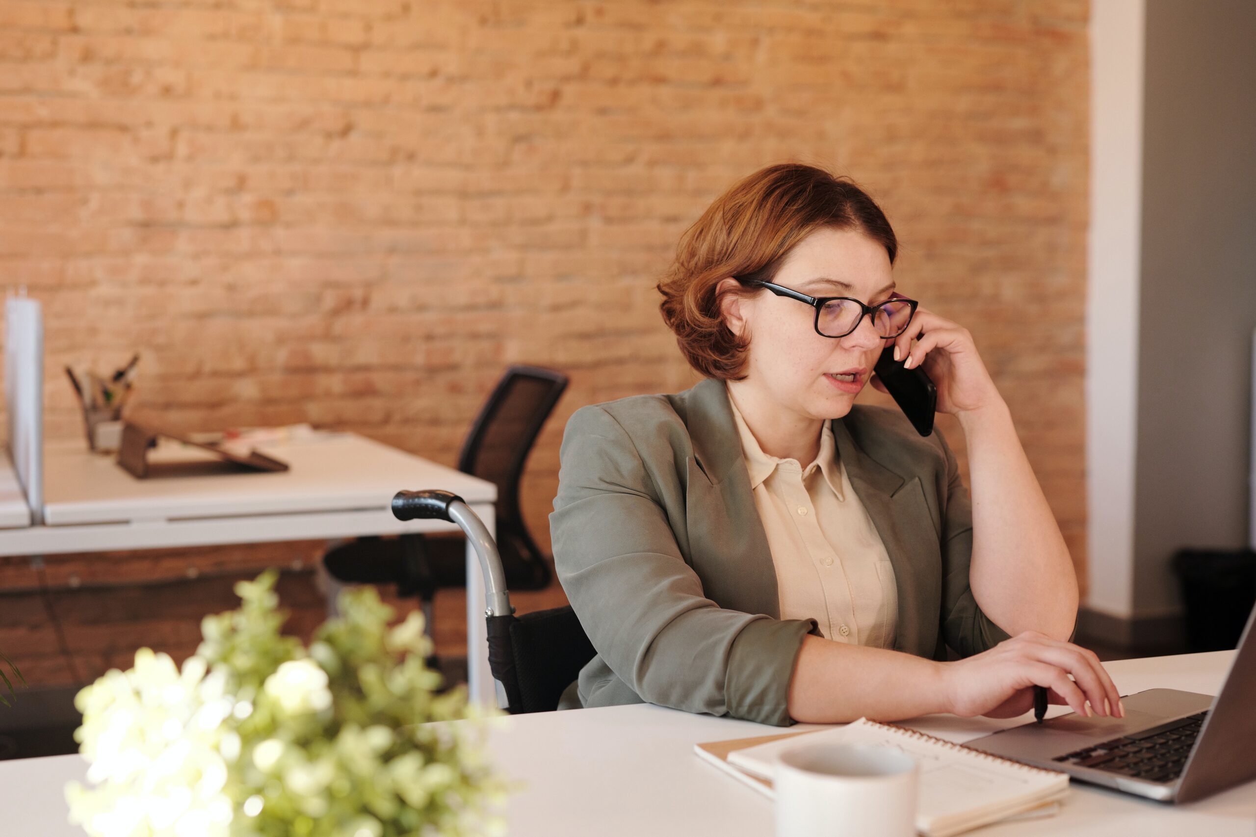 a lady receiving a phone call in an office