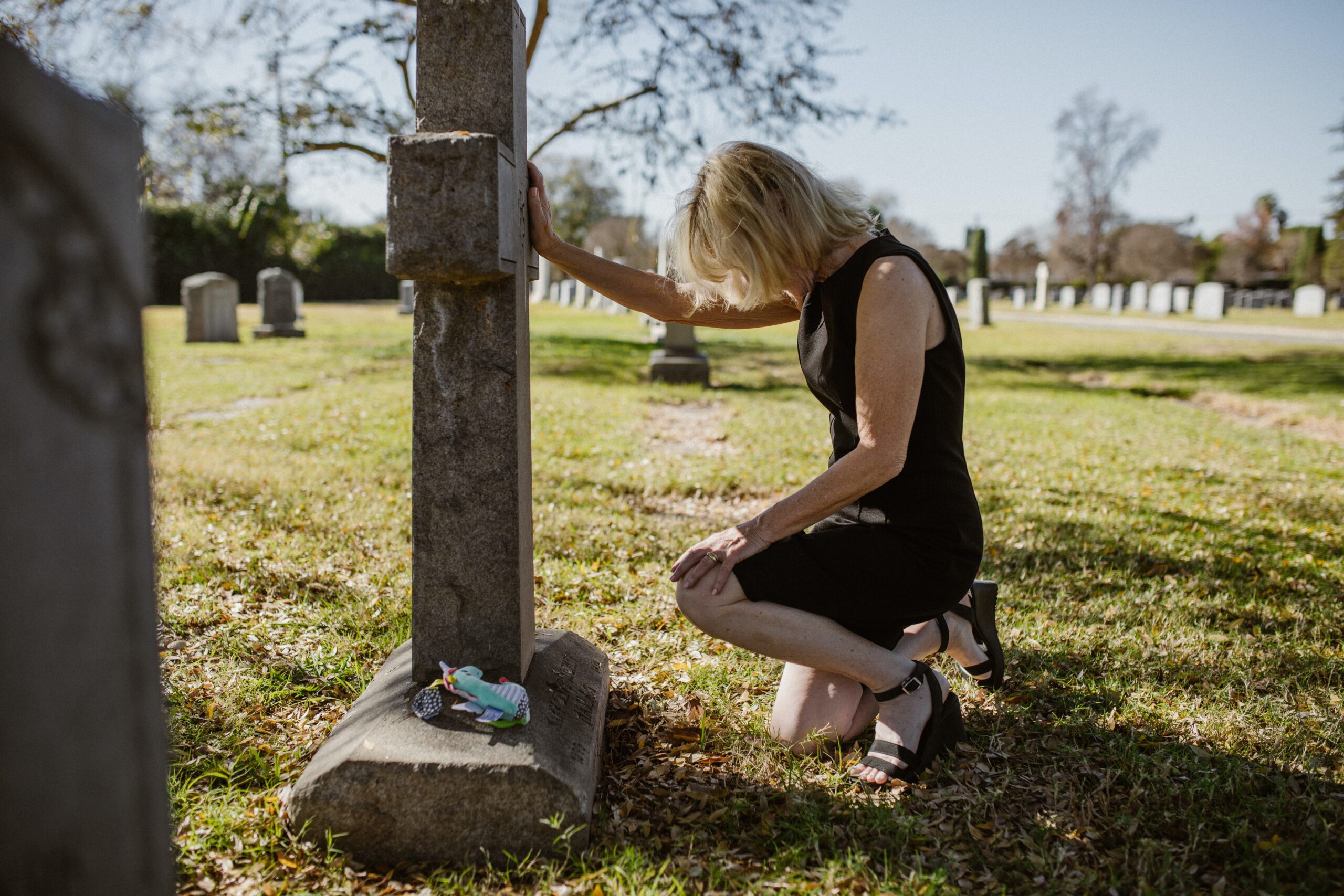 Someone grieving at the cemetry