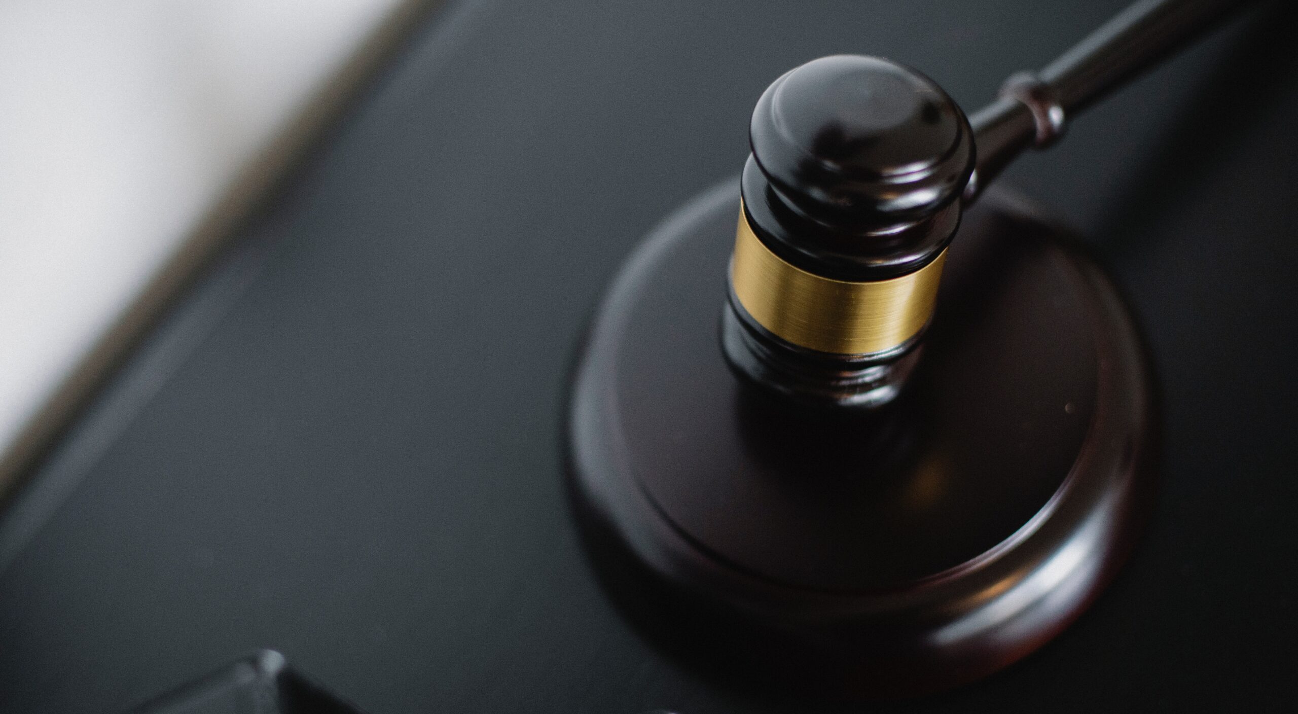 A close up of a black judge’s gavel