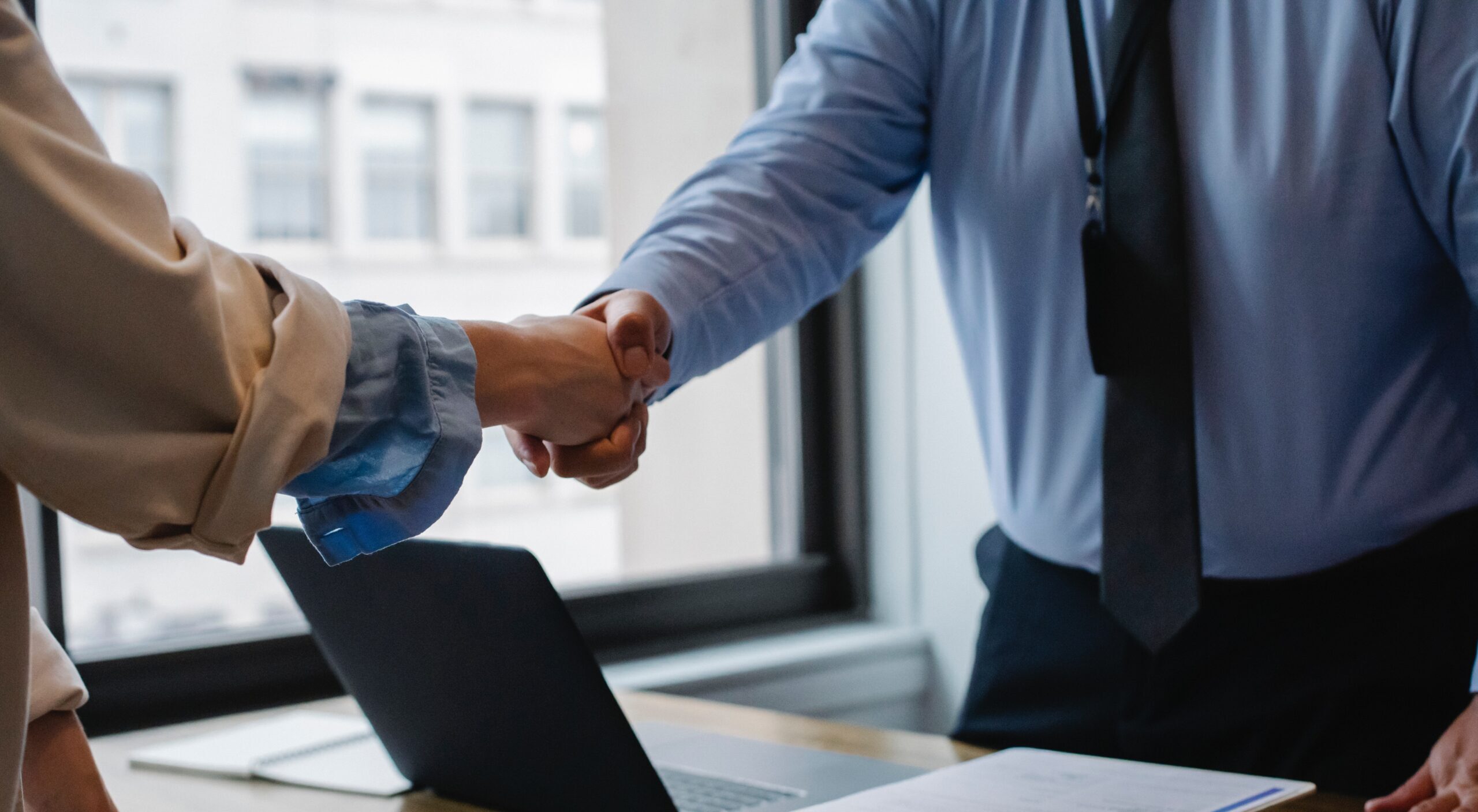 An attorney and a client shaking hands