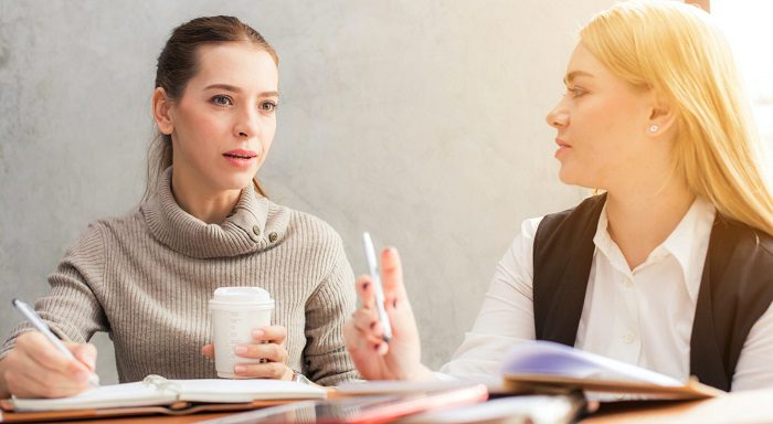 Two women discussing