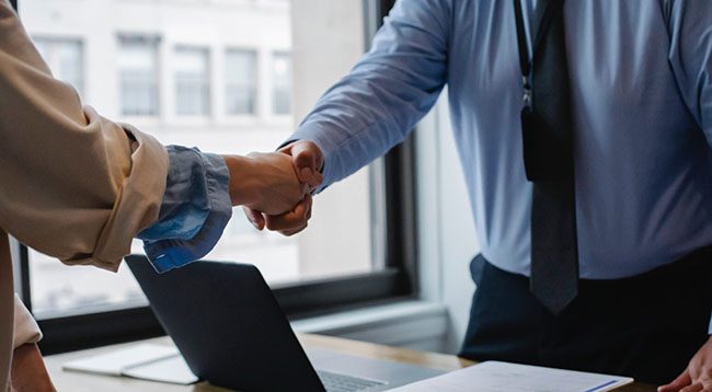 An attorney and a client shaking hands