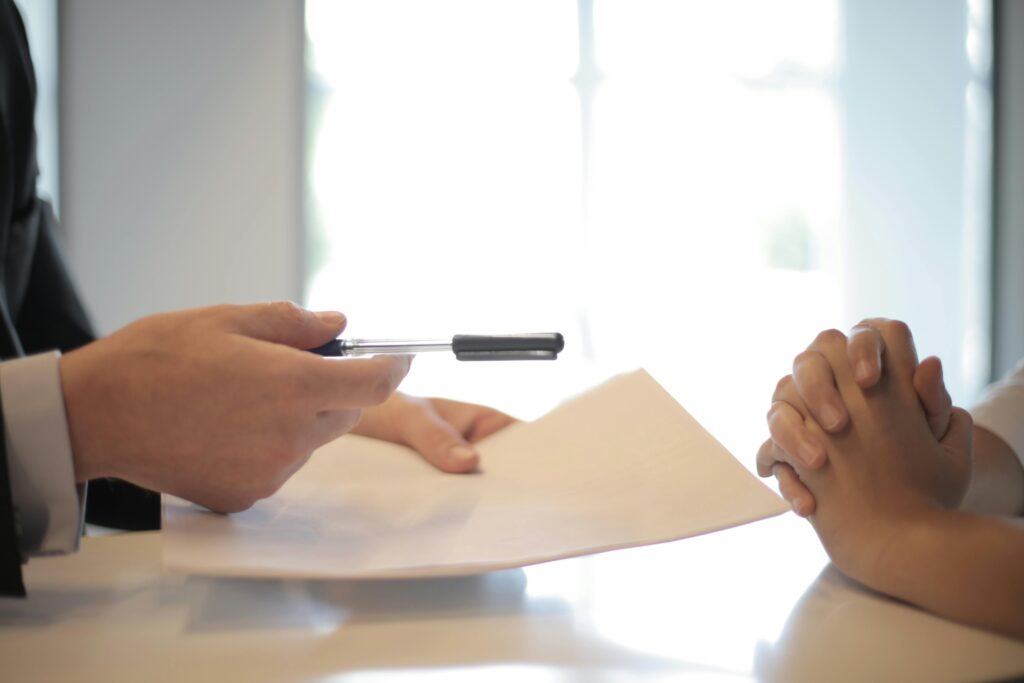Client receiving legal paperwork and guidance on a personal injury claim